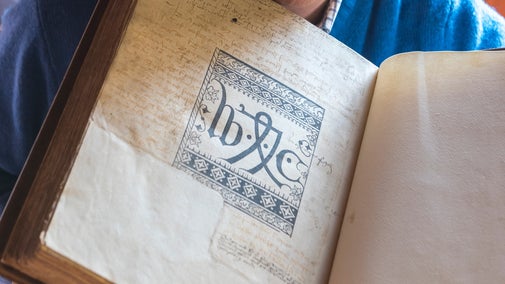 The Sarum Missal at Lyme showing the initials of William Caxton who produced the book in 1487 in conjunction with the printer Guillame Maynyal in Paris.